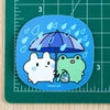 Bunny and Froggy Shopping In Rain Vinyl Sticker